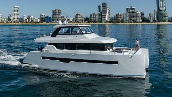 ILIAD 62 Luxury ILIAD 62 yacht cruising near city skyline, 2026 model.