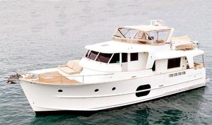 Beneteau Swift Trawler 52 2009 Beneteau Swift Trawler 52 cruising on calm waters.