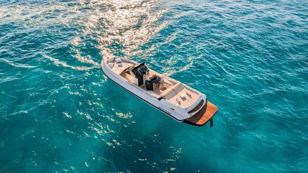 Scanner Envy 1100 Aerial view of Scanner Envy 1100 boat on clear blue water, 2020 model.