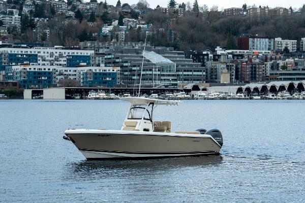 Pursuit C 260 Center Console 2018 Pursuit C 260 Center Console boat on urban waterfront.
