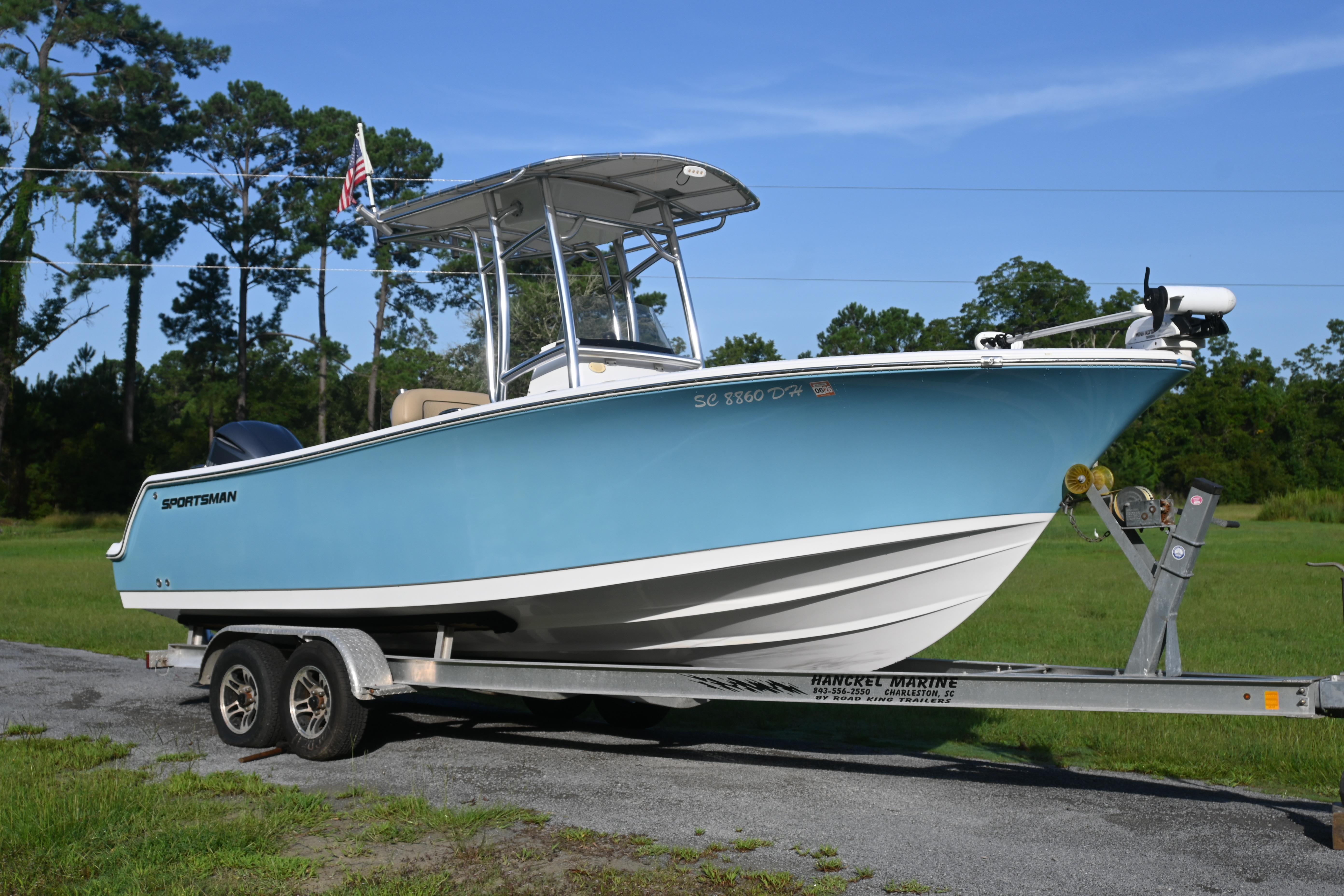 Sportsman Open 232 Center Console 2018 Sportsman Open 232 Center Console boat on trailer, parked outdoors.