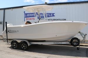 Robalo R230 Center Console 2024 Robalo R230 Center Console boat on trailer at dealership.