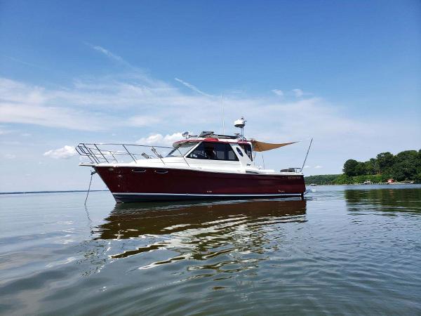 Cutwater 28 2011 Cutwater 28 boat on calm water with clear blue sky.