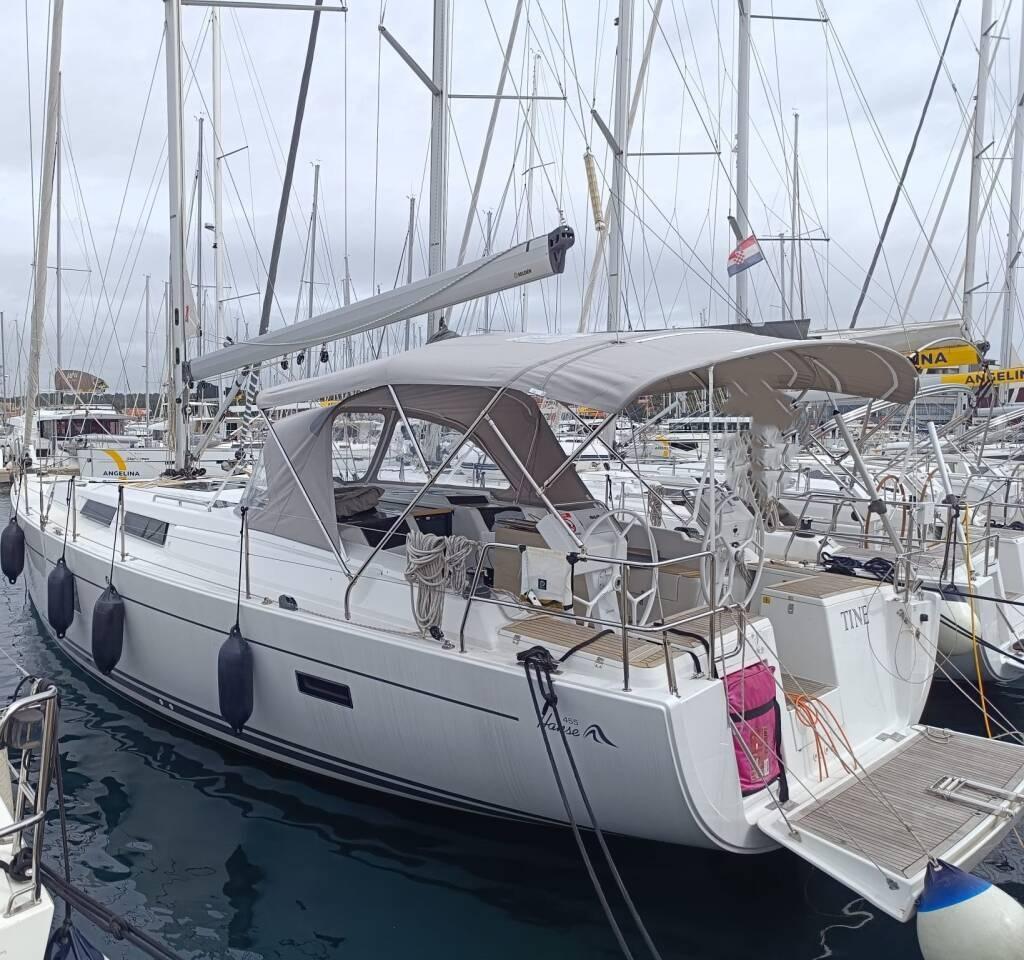 Hanse 455 Sailing yacht Hanse 455, 2018 model, docked in a marina with overcast skies.