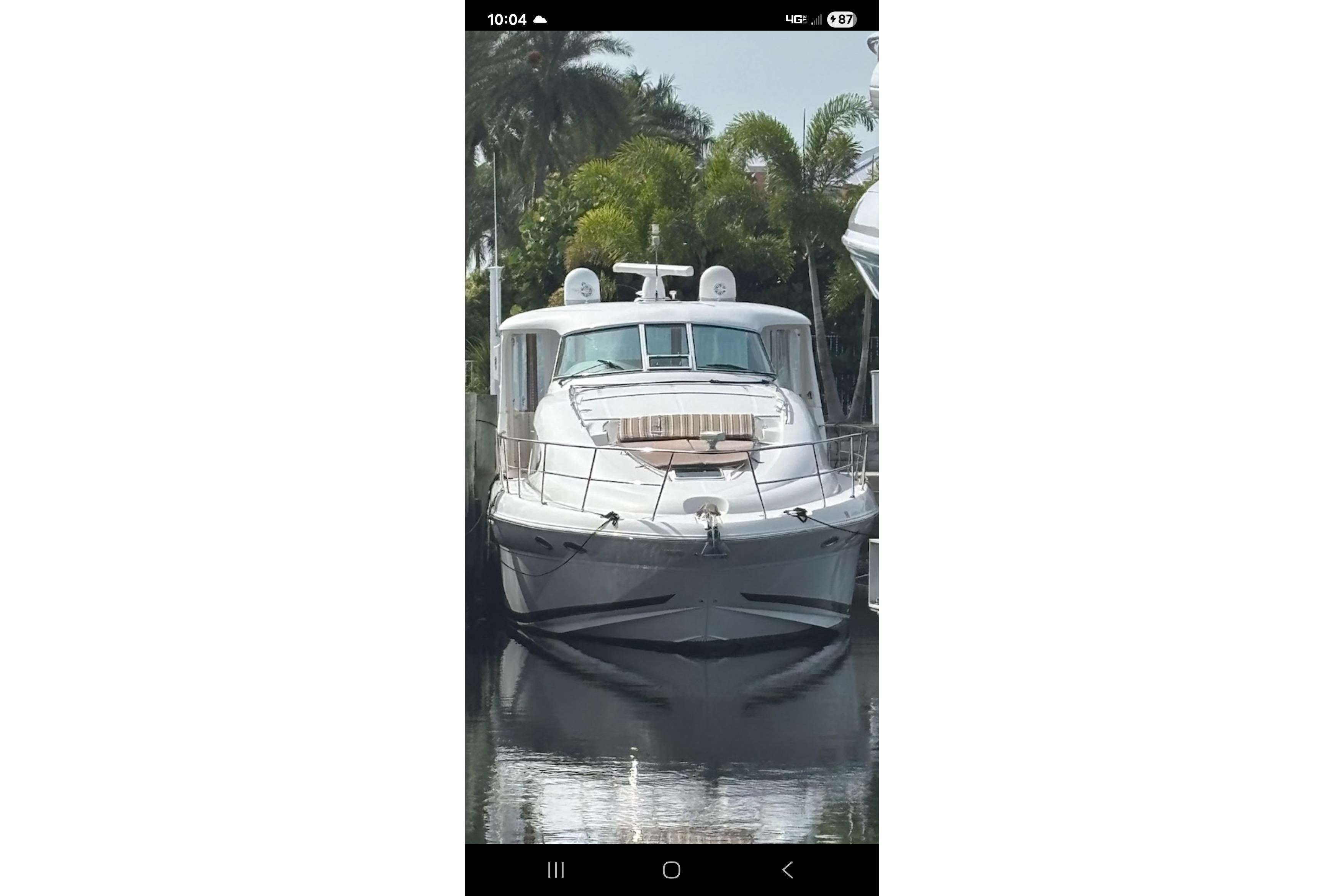 Sea Ray 480 Motor Yacht 2004 Sea Ray 480 Motor Yacht docked, surrounded by lush greenery.