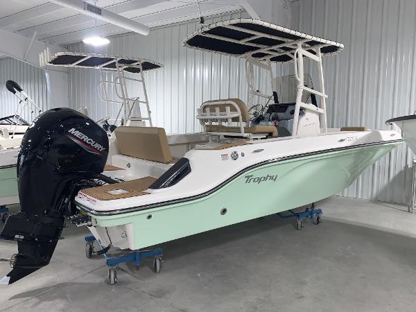 Bayliner Trophy 20CX 2024 Bayliner Trophy 20CX boat with Mercury outboard motor in showroom.