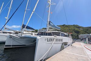 Fountaine Pajot Astrea 42 2020 Fountaine Pajot Astrea 42 catamaran docked at marina under clear blue sky.