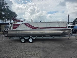 South Bay 523 CR 2017 South Bay 523 CR pontoon boat on trailer, parked outdoors.