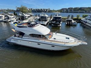 Nord West 420 Flybridge 2008 Nord West 420 Flybridge yacht docked in a marina, surrounded by other boats.