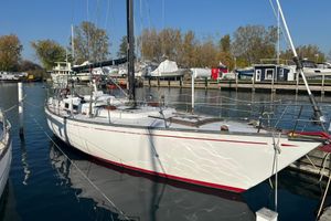 Tartan 46 1972 Tartan 46 sailboat docked in a marina under clear blue skies.