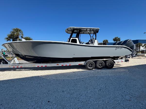Yellowfin 36 Offshore 2025 Yellowfin 36 Offshore boat on a trailer, parked outdoors under a clear blue sky.