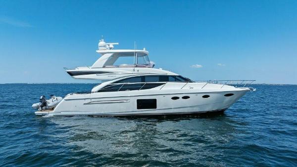 Princess 60 Flybridge 2016 Princess 60 Flybridge yacht cruising on open water under clear blue skies.