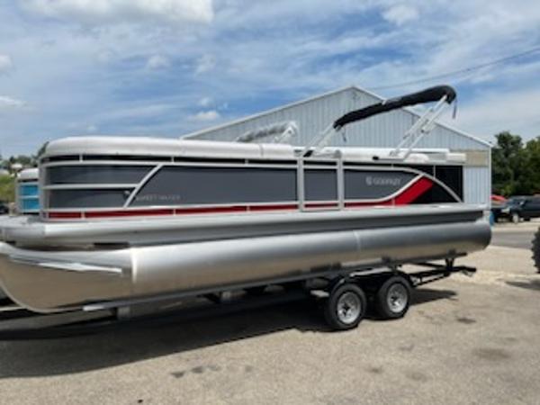 Sweetwater 2286C 2024 Sweetwater 2286C pontoon boat on a trailer, parked outdoors.
