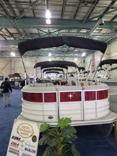 Berkshire Tritoon 22 RFX CTS 2024 Berkshire Tritoon 22 RFX CTS displayed indoors at a boat show.