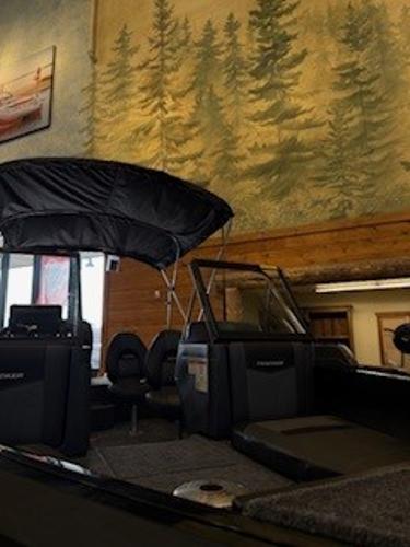 Tracker Targa V-19 Combo 2025 Tracker Targa V-19 Combo boat displayed indoors with forest mural background.