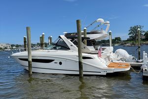 Sea Ray 350 Sundancer 2015 Sea Ray 350 Sundancer yacht docked at marina, clear blue sky.