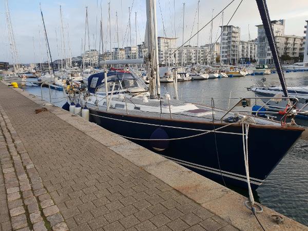 Najad 460 Najad 460 sailboat from 2004 docked at a marina with other boats.