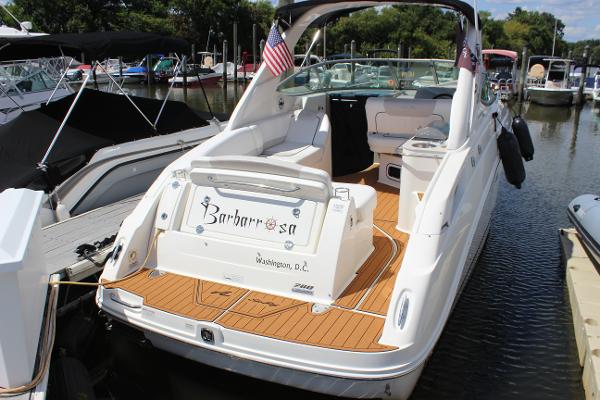 Sea Ray 280 Sundancer 2012 Sea Ray 280 Sundancer boat docked, featuring teak deck and American flag.