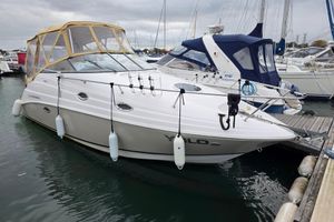 Regal Commodore 2665 2007 Regal Commodore 2665 boat docked at marina with protective canopy.