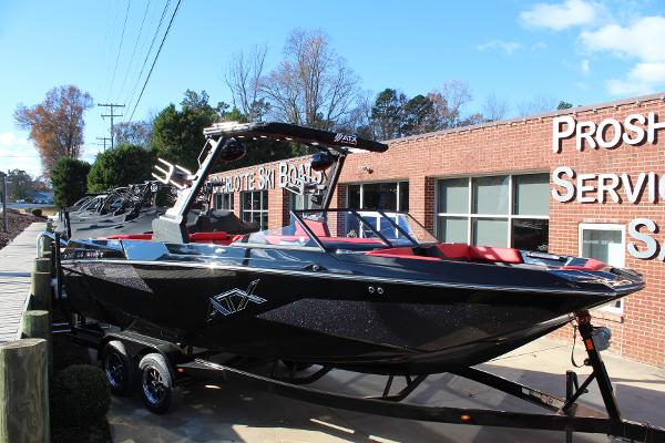 ATX Surf Boats 24 Type-S 2024 ATX Surf Boats 24 Type-S, black exterior, parked outside a service building.