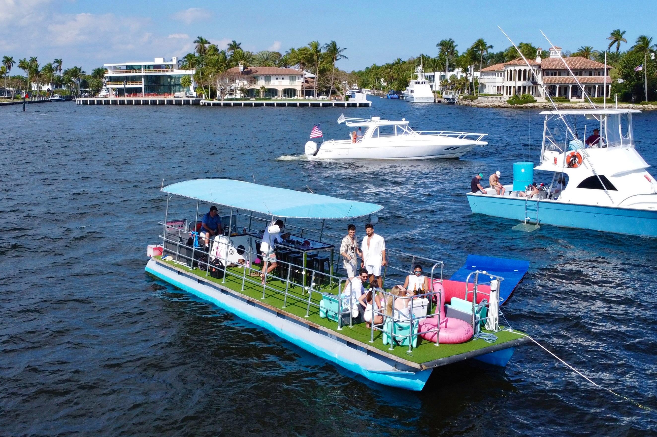 Marell Pontoon 2023 Maurell Pontoon boat with passengers enjoying a sunny day on the water.
