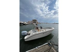 Eolo AS 19 GL OPEN 2025 Eolo AS 19 GL OPEN boat docked at marina with Honda engine.