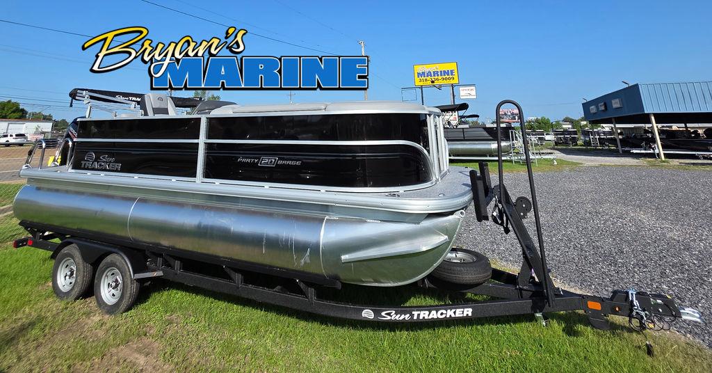 Sun Tracker Party Barge 20 DLX 2026 Sun Tracker PARTY BARGE® 20 DLX pontoon boat on trailer at Bryan's Marine dealership.