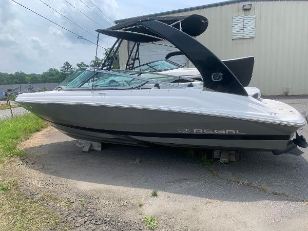 Regal 2000 ES Bowrider 2018 Regal 2000 ES Bowrider boat on blocks, parked outdoors near a building.