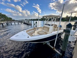 Scout 215 XSF 2020 Scout 215 XSF boat docked on a sunny day with blue skies.