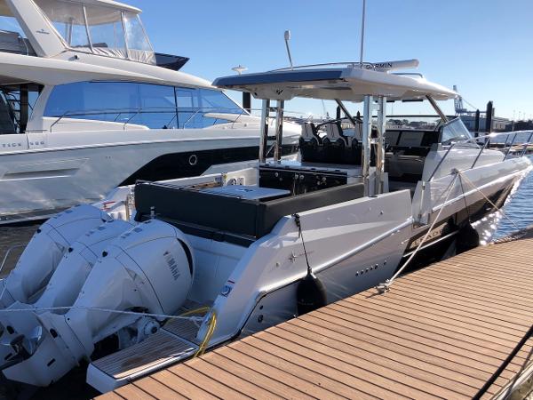 Jeanneau Leader 12.5 WA 2024 Jeanneau Leader 12.5 WA boat docked with twin outboard engines.