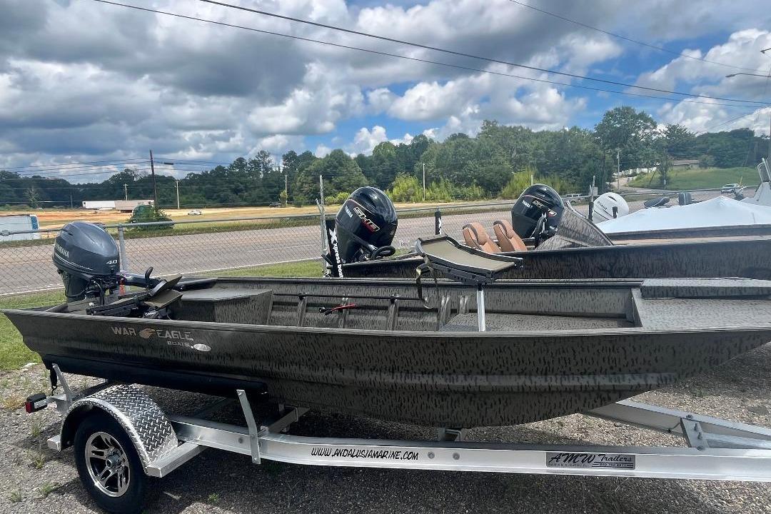 War Eagle 648LDV 2026 War Eagle 648LDV boat on trailer, featuring dual outboard motors, parked outdoors.