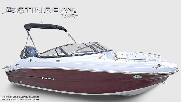 Stingray 211 DC 2025 Stingray 211 DC boat with maroon hull and black canopy, side view.