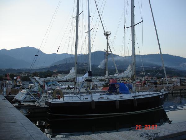 Custom ketch acciaio 38 Sailboat "Custom Ketch Acciaio 38" docked in a marina, mountains in the background.