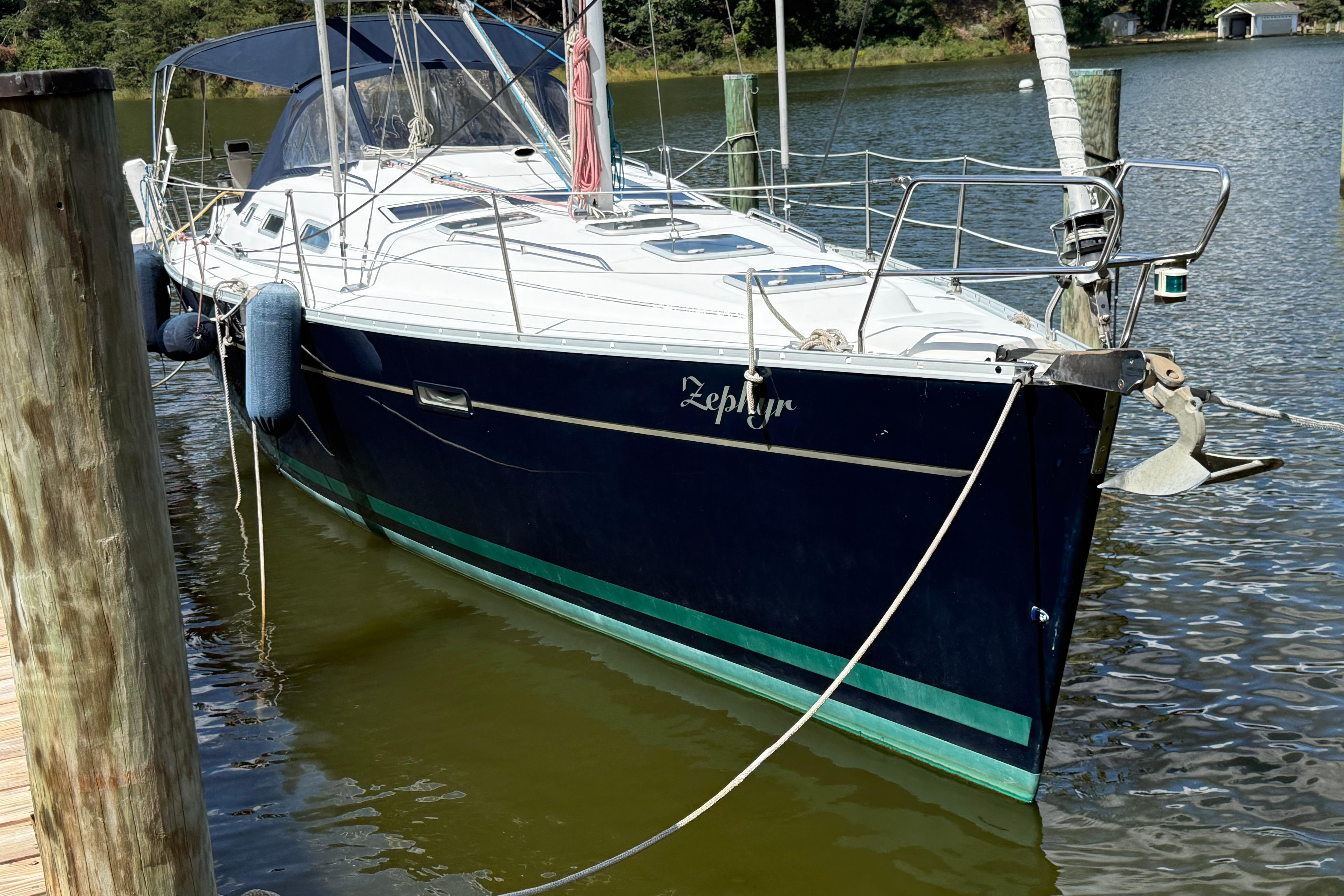 Beneteau 393 2002 Beneteau 393 sailboat docked, featuring sleek design and blue hull.