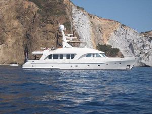 Moonen MOONEN 84 Luxury Moonen 84 yacht from 2003 cruising near rocky coastline.
