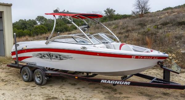 Correct Craft Air Nautique 226 LE 2007 Correct Craft Air Nautique 226 LE boat on trailer, red and white design.