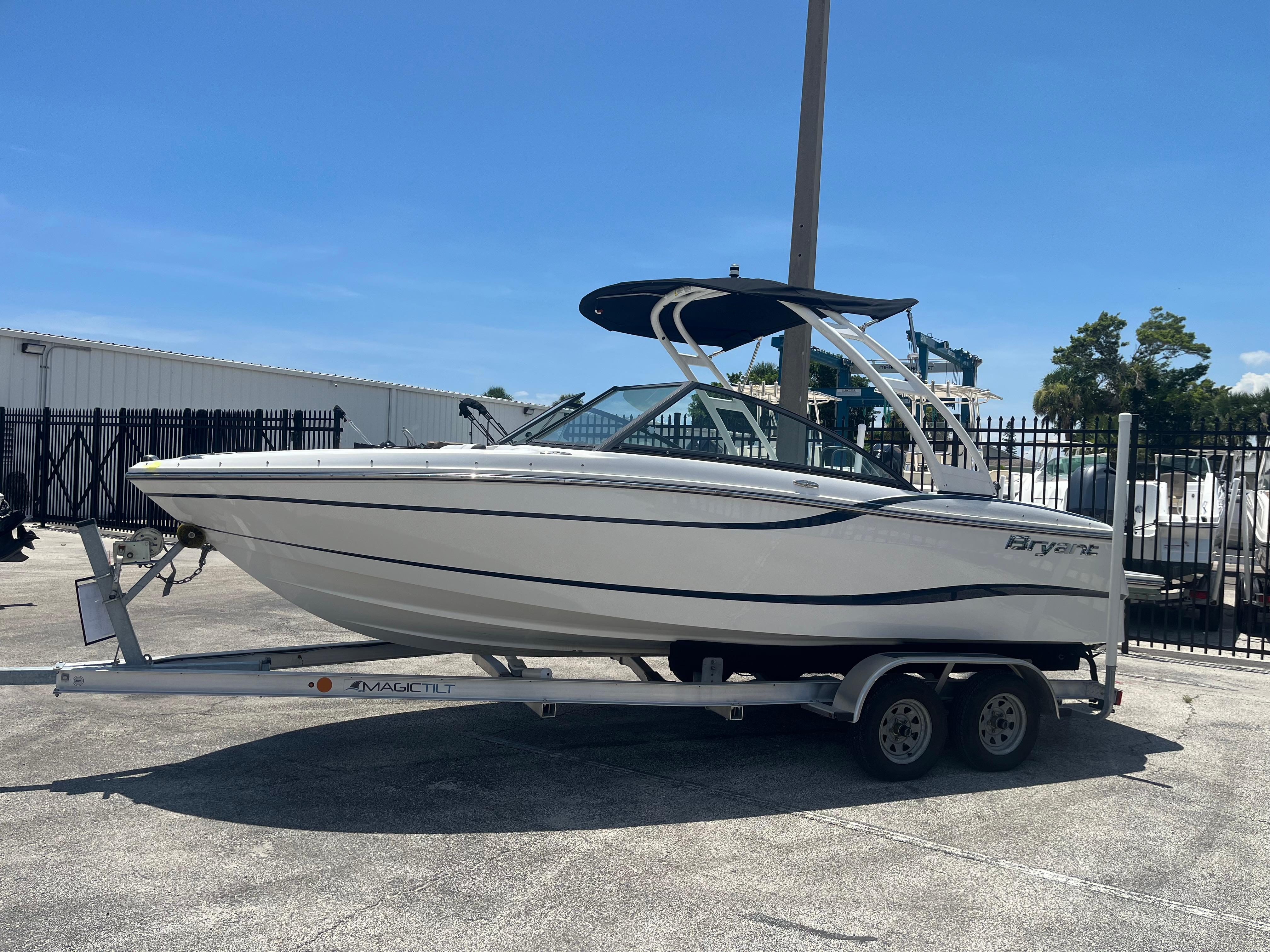 Bryant Speranza 2019 Bryant Speranza boat on trailer, parked outdoors under clear blue sky.