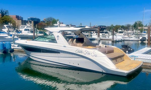 Sea Ray SLX 400 2018 Sea Ray SLX 400 yacht docked in a marina under clear blue skies.