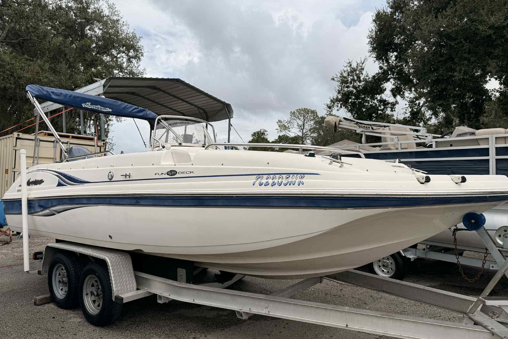 Hurricane FunDeck GS 211 OB 2008 Hurricane FunDeck GS 211 OB boat on trailer, parked outdoors.
