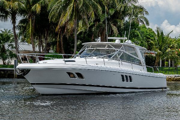 Intrepid 475 Sport Yacht 2014 Intrepid 475 Sport Yacht cruising on a tropical waterway.