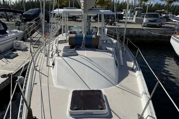 Catalina Morgan 440 1989 Catalina Morgan 440 sailboat docked at marina, featuring spacious deck and railing.