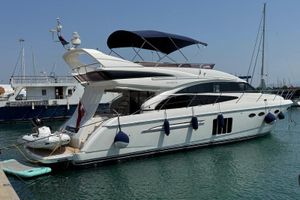 Princess 60 Luxury 2012 Princess 60 yacht docked in marina, featuring sleek design and modern amenities.