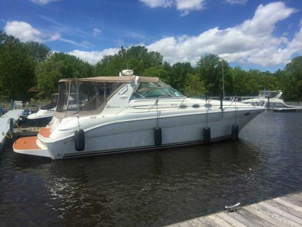 Sea Ray 370 Sundancer 1995 Sea Ray 370 Sundancer yacht docked on a sunny day with clear skies.