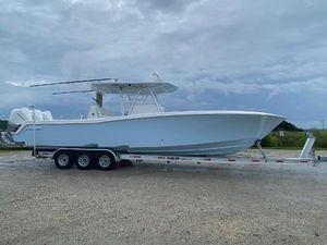 Invincible 36 Open Fisherman 2021 Invincible 36 Open Fisherman boat on trailer under cloudy sky.