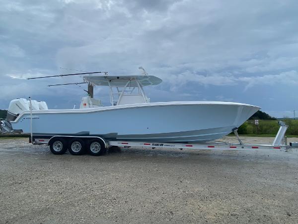 Invincible 36 Open Fisherman 2021 Invincible 36 Open Fisherman boat on trailer under cloudy sky.