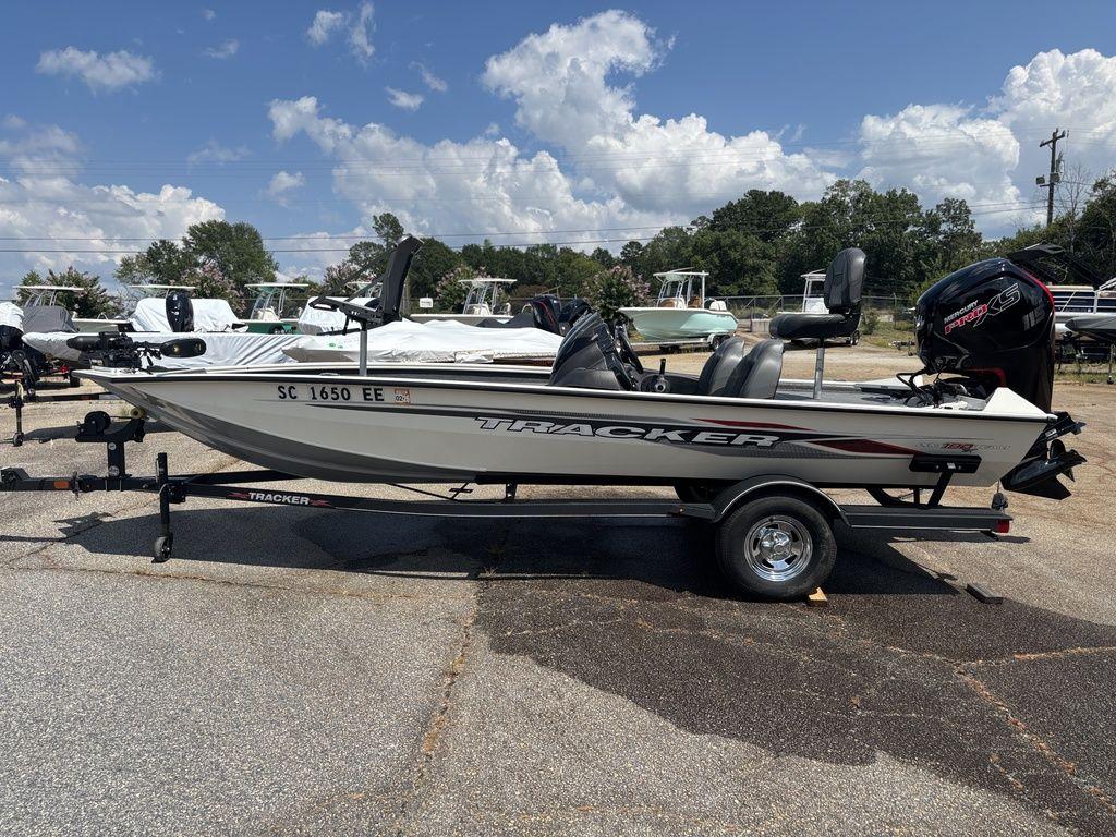 Tracker Pro Team 190 TX 2013 Tracker Pro Team™ 190 TX boat on trailer, parked outdoors under a clear sky.