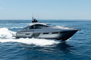 Pershing 7X 2024 Pershing 7X yacht cruising on open sea under clear blue sky.