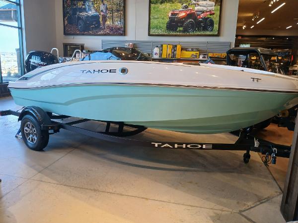 Tahoe T16 2025 Tahoe T16 boat on display in showroom with trailer.