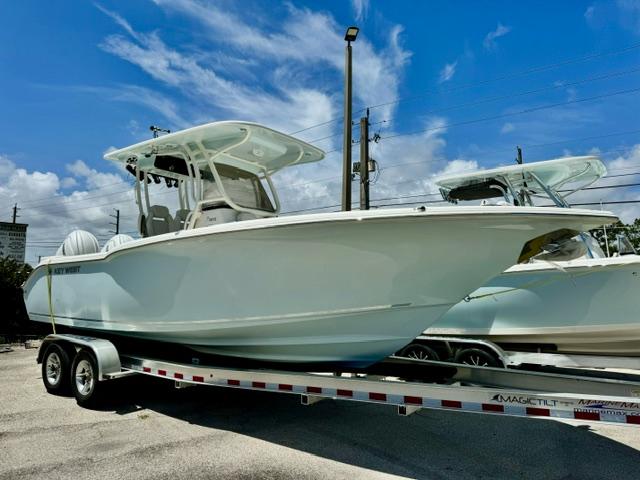 Key West 260 CC 2026 Key West 260 CC boat on trailer under blue sky.