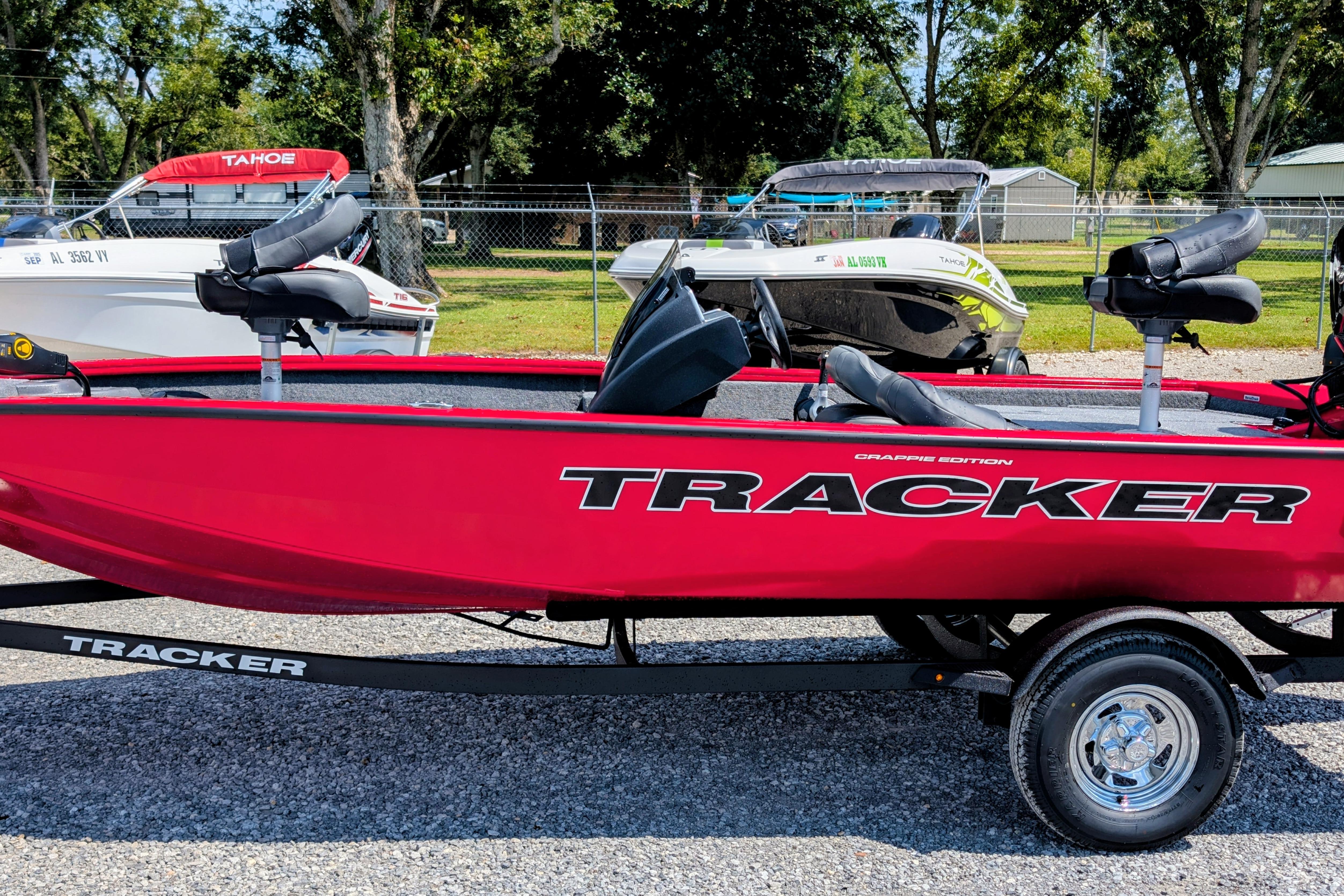 Tracker Pro Team 175 Crappie Edition 2026 Tracker Pro Team 175 Crappie Edition boat, red, parked outdoors on a trailer.